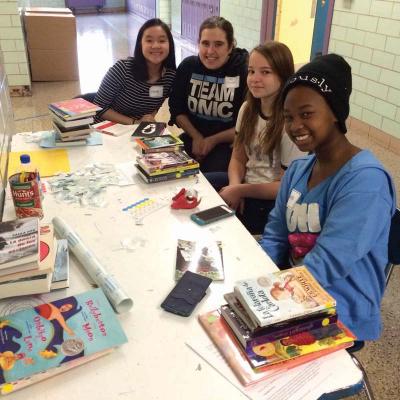 McCormack sixth-grade English teacher Kate Fussner (second from left) with her former students, Christy Nguyen (first on left), Viktoriya Ryback, and Ananda Hines, who are all currently eighth grade students at Boston Latin School.